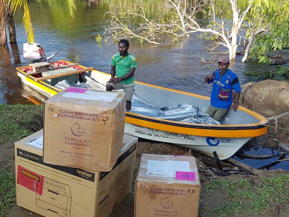 Kits arrive by boat in East Sepik province, Papua New Guinea